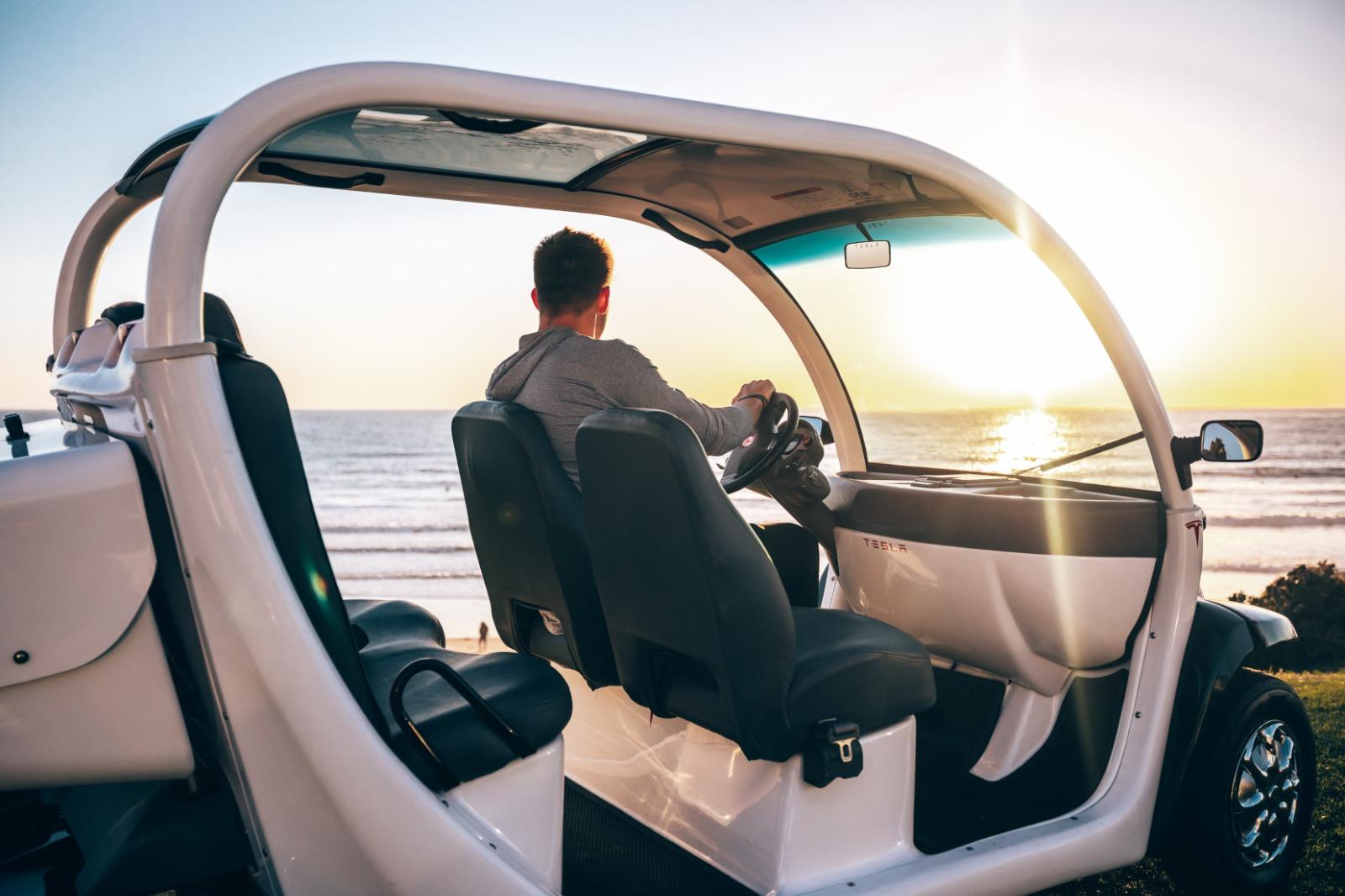 Man driving golf cart